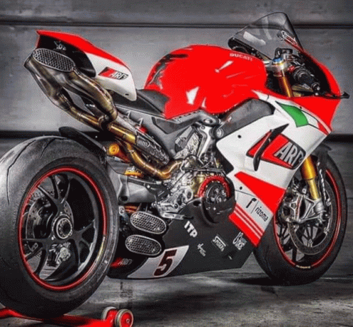 A Red And White Ducati Motorcycle With The Number 5 GIF