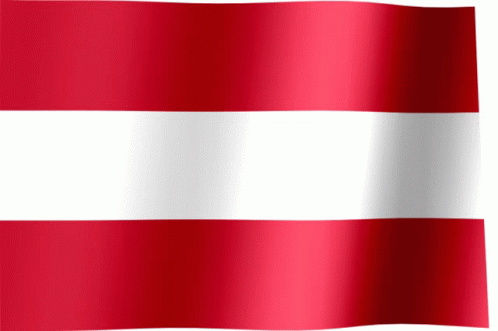 A Red And White Striped Flag Is Waving In The Wind GIF