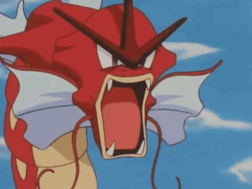 A Red And Yellow Pokemon With Its Mouth Open Is Screaming . GIF