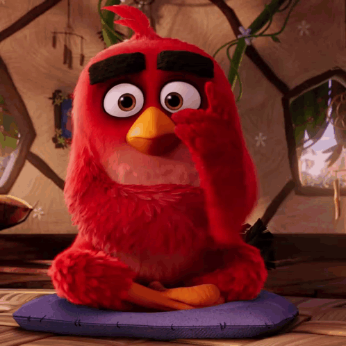 Red Angry Bird Sitting On Purple Pillow GIF