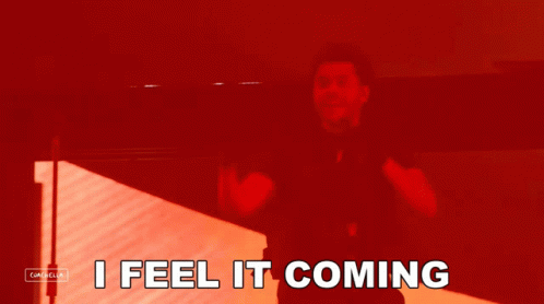 A Red Background With The Words I Feel It Coming In White GIF