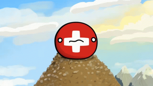 A Red Ball With A White Cross On It Is On Top Of A Rocky Hill GIF