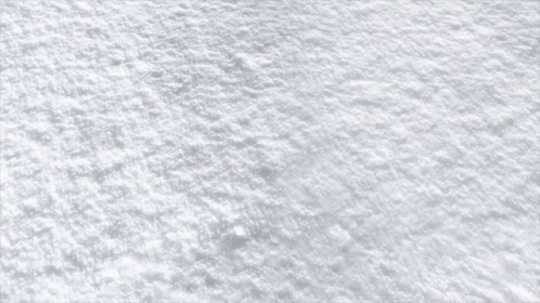A Red Brick Is Laying On A Snowy Surface GIF