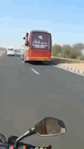 A Red Bus With The Word Han School On The Back Of It GIF