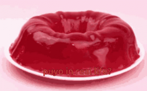 A Red Cake On A White Plate With The Words Puyo In Real Life GIF