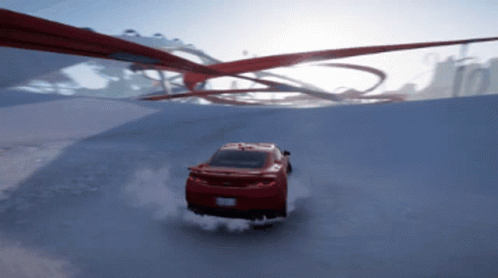 A Red Car Driving Down A Snowy Road GIF