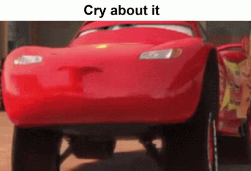 A Red Car From The Movie Cars Is Driving Down A Road . GIF