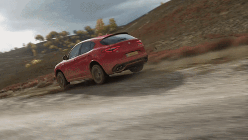 A Red Car Is Driving Down A Dirt Road And Has A License Plate That Says ' Lkc ' On It GIF