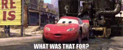 A Red Car Is Driving Down A Dirt Road With The Words What Was That For On The Bottom GIF