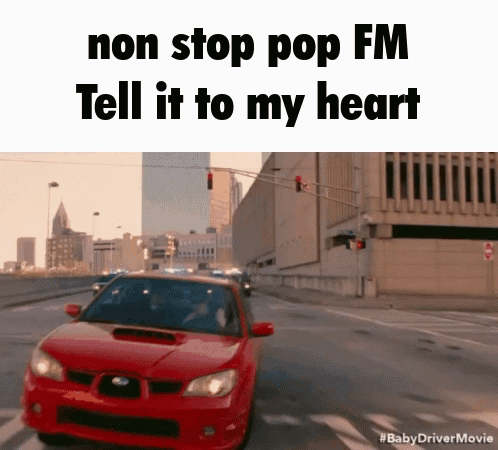 A Red Car Is Driving Down A Street With The Words " Non Stop Pop Fm Tell It To My Heart " GIF