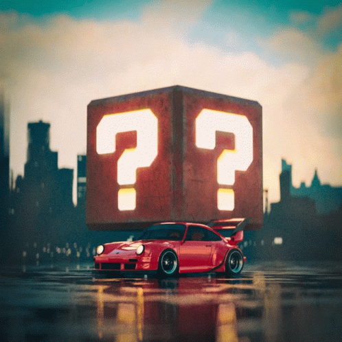 A Red Car Is Sitting On Top Of A Cube With Two Question Marks On It GIF