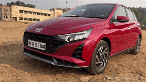 A Red Car With A License Plate That Says Mp08zc6188 GIF