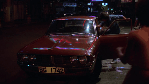A Red Car With License Plate Bg 1742 GIF