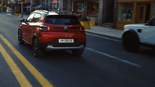 A Red Car With The License Plate Vm-D80-Vx GIF