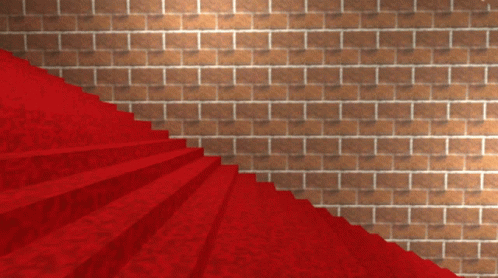 A Red Carpeted Staircase Leading Up To A Brick Wall GIF