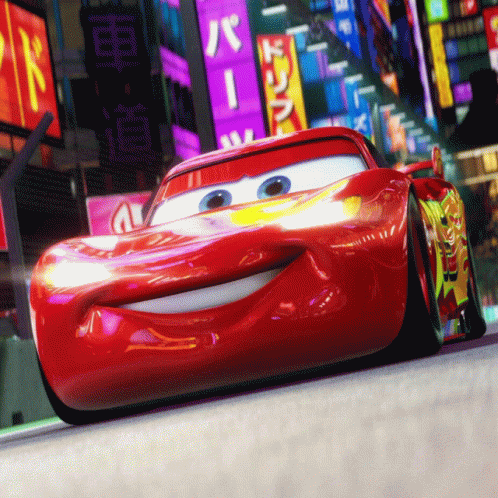 A Red Cartoon Car Is Driving Down A Street With A Sign That Says ' R ' On It GIF