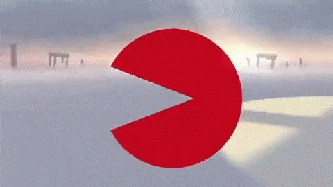 a red circle with a slice taken out of it and a sunset in the background