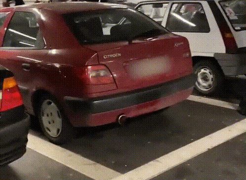 A Red Citroen Car Parked In A Parking Lot GIF