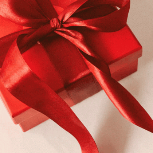 A Red Gift Box With A Red Bow GIF