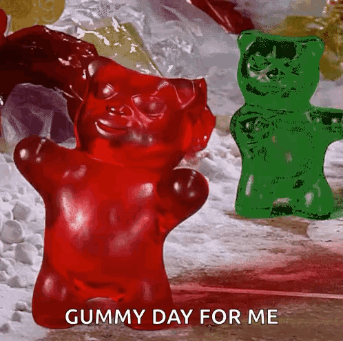 A Red Gummy Bear Is Standing Next To A Green Gummy Bear With The Words Gummy Day For Me Below It GIF