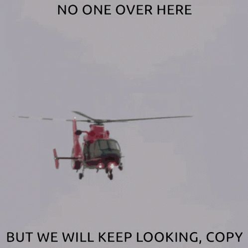 A Red Helicopter Is Flying In The Sky With The Words " No One Over Here But We Will Keep Looking Copy " GIF