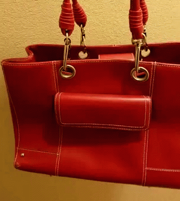 A Red Leather Purse With A Small Pocket On The Side Of It GIF