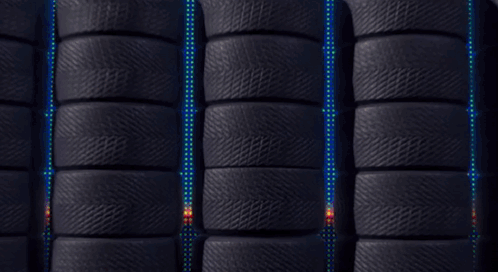 A Red Lightyear 95 Car Is Surrounded By Black Tires GIF