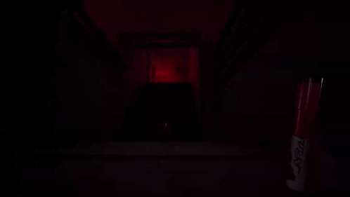 a red marker with the word sharpie on it sits in a dark room