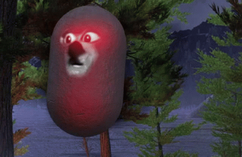 A Red Object With A Face On It Is Standing In A Forest GIF