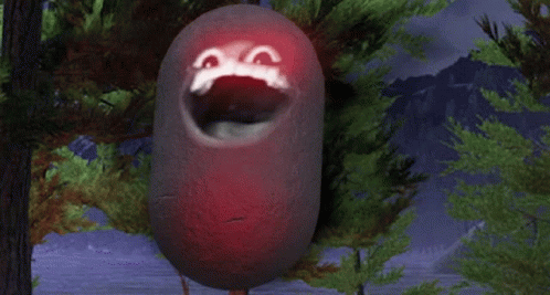 A Red Object With A Face Painted On It Is Hanging From A Tree Branch GIF