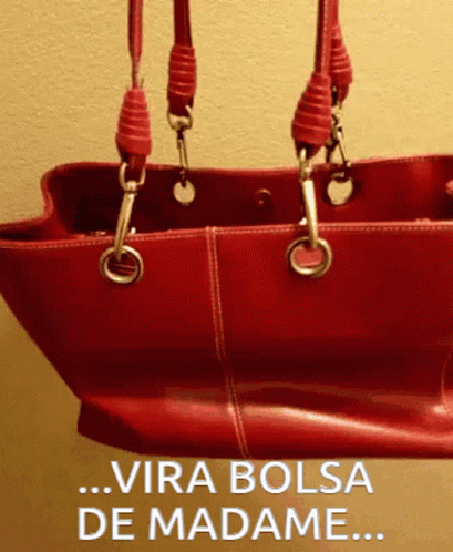 A Red Purse With The Words Vira Bolsa De Madame On The Bottom GIF
