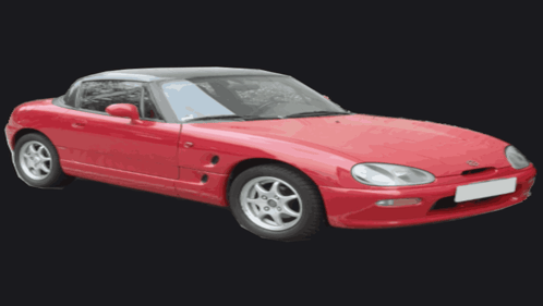 A Red Sports Car With A Black Top And Silver Wheels GIF