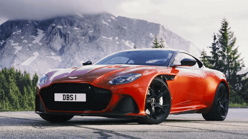 A Red Sports Car With A License Plate That Says Dbsi GIF