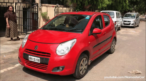 A Red Suzuki Car With A License Plate That Says Nmp27 Cb 2108 GIF