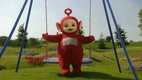 A Red Teletubbies Character Is Swinging On A Blue Swing GIF