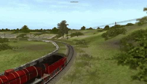 A Red Train Is Going Down The Tracks With A Screen That Says Www.youtube.com GIF