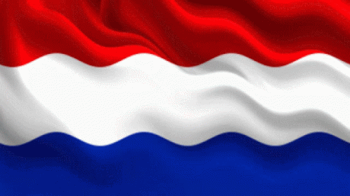 a red white and blue flag waving in the wind on a white background