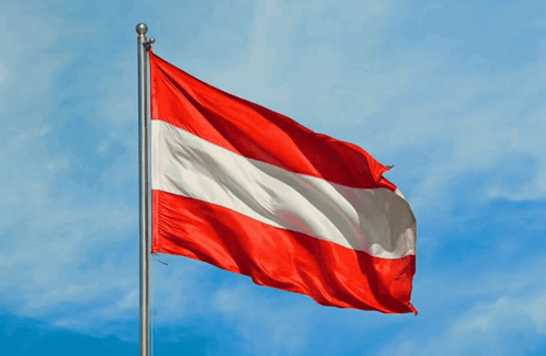 A Red White And Blue Flag With A Blue Sky In The Background GIF