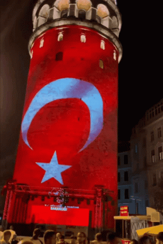 A Red White And Blue Tower With A Star And Crescent Moon On It GIF