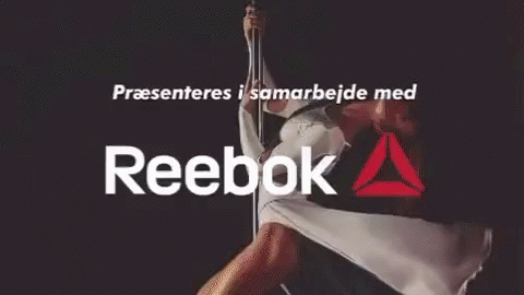 A Reebok Ad With A Man Doing A Handstand GIF