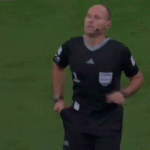 A Referee Holds Up A Yellow Card That Says Fifa GIF