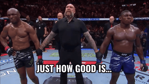 A Referee Stands Between Two Fighters With The Words Just How Good Is Behind Him GIF