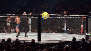 A Referee Stands In A Boxing Ring With A Tear Coming Out Of His Eyes GIF