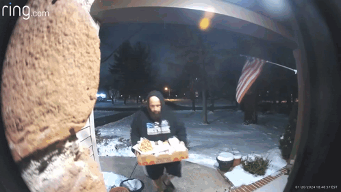 A Ring Camera Shows A Man Carrying A Box Of Domino 'S Pizza GIF