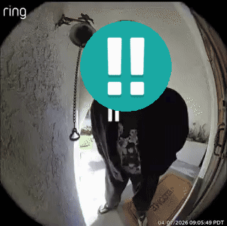 A Ring Camera Shows A Man Standing In Front Of A Door With An Exclamation Point On His Face GIF