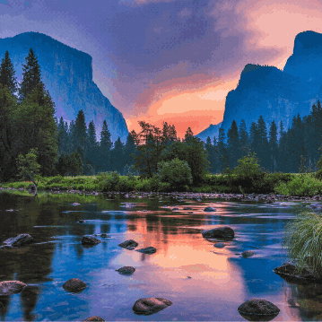A River With Mountains In The Background And A Sunset In The Sky GIF