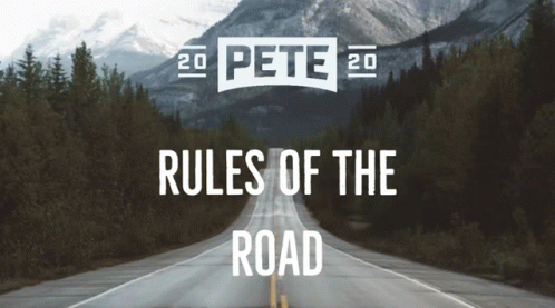 A Road With Mountains In The Background And The Words Rules Of The Road GIF