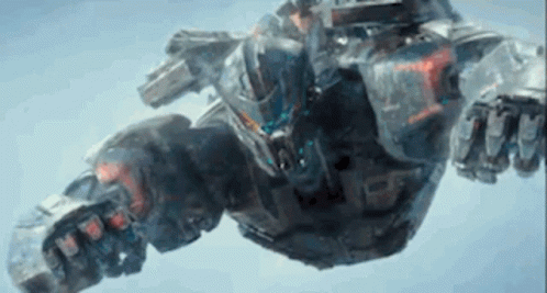 A Robot Is Flying Through The Air With A Gun . GIF