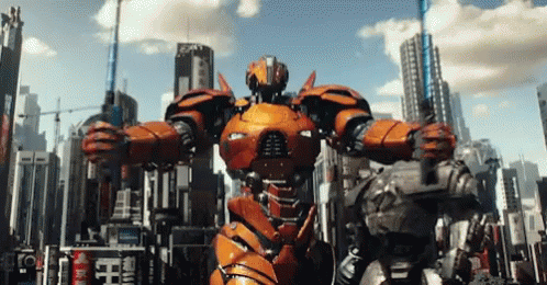 A Robot Is Standing In Front Of A City With A Sign That Says ' Emperor ' On It GIF