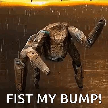 A Robot Is Standing In The Rain With The Words `` Fist My Bump '' Written On The Bottom . GIF
